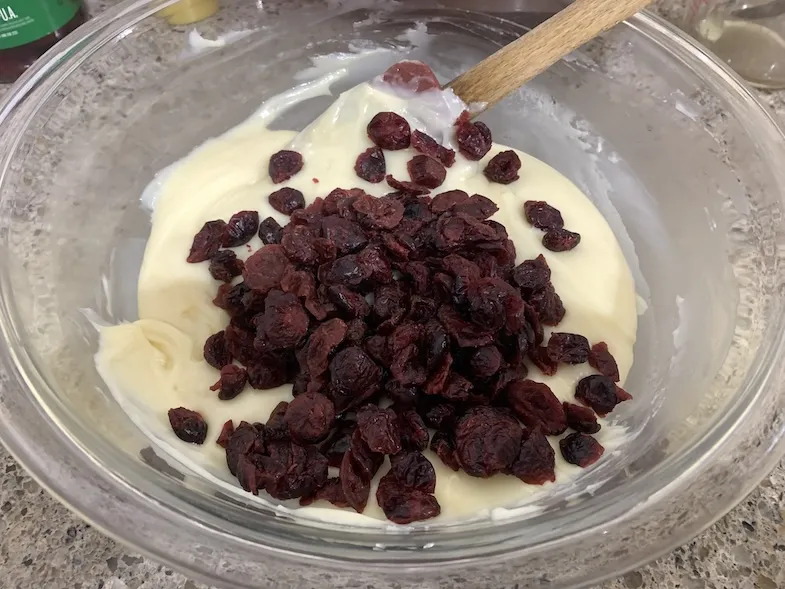 adding cranberries to the fudge