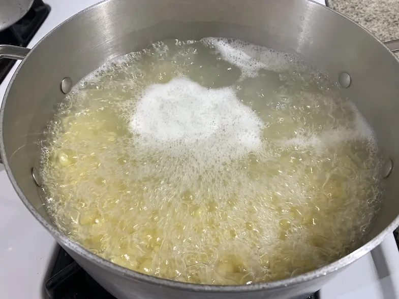 photo of gluten-free pasta boiling in pot