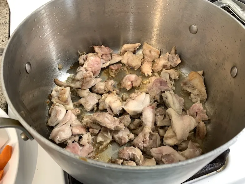 chicken-thigh-cut-into-pieces-and-frying