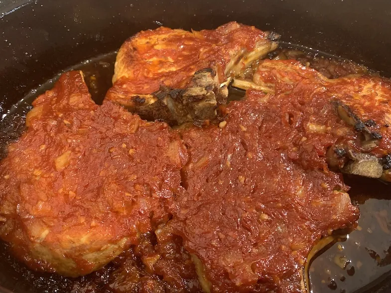 cooked BBQ pork chops in the casserole dish just out of the oven