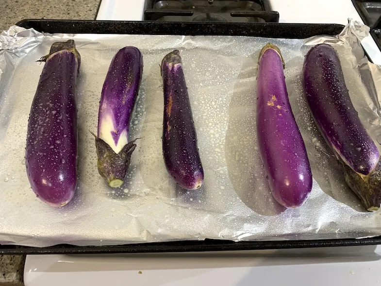 Japanese eggplants on a baking tray