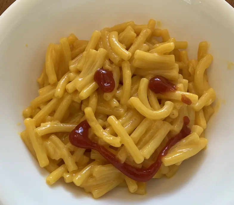 KD gluten-free macaroni and cheese with a ketchup smiley face