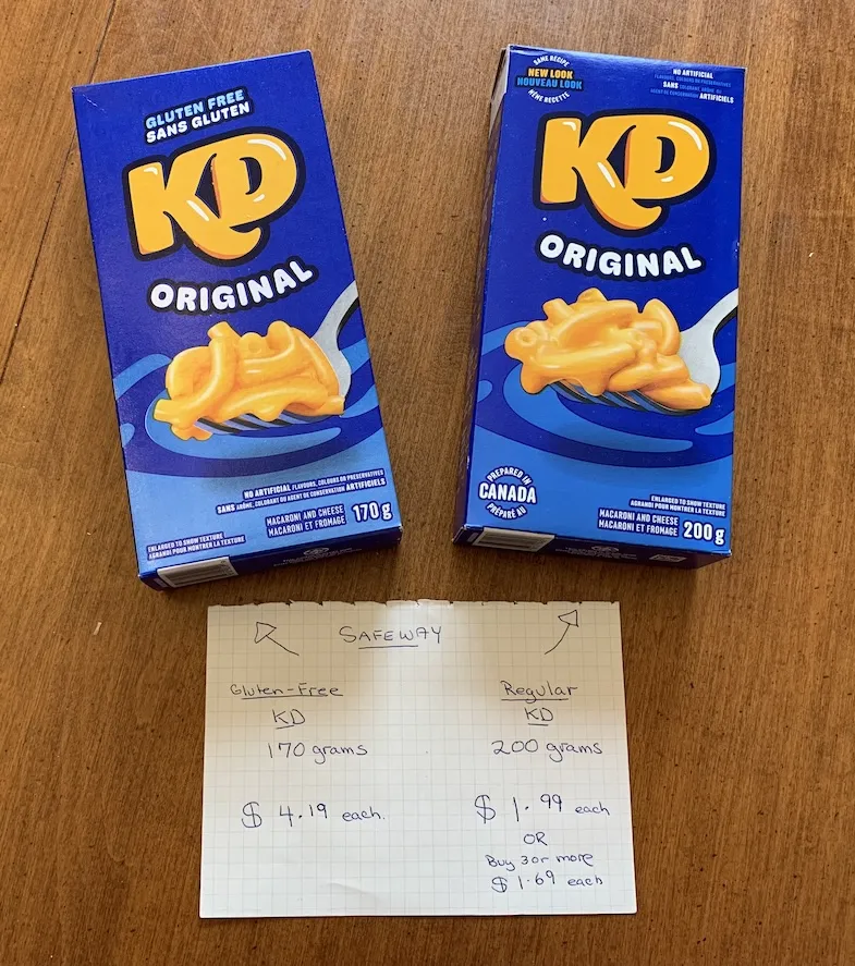 Photo of gluten-free and regular Kraft Dinner Mac n Cheese with a price comparison