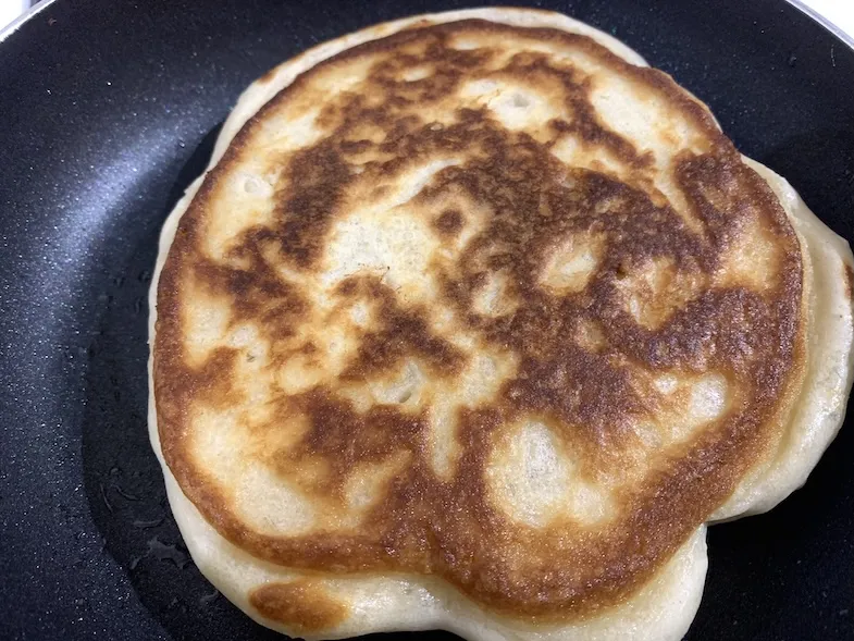 gluten-free pancake flipped to fry the other side