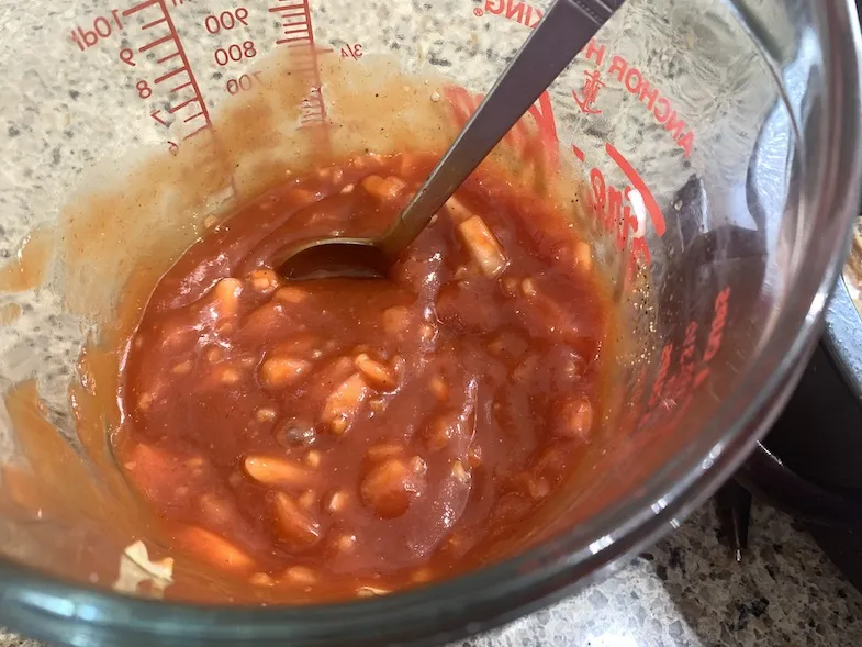 mixed BBQ sauce in a measuring cup