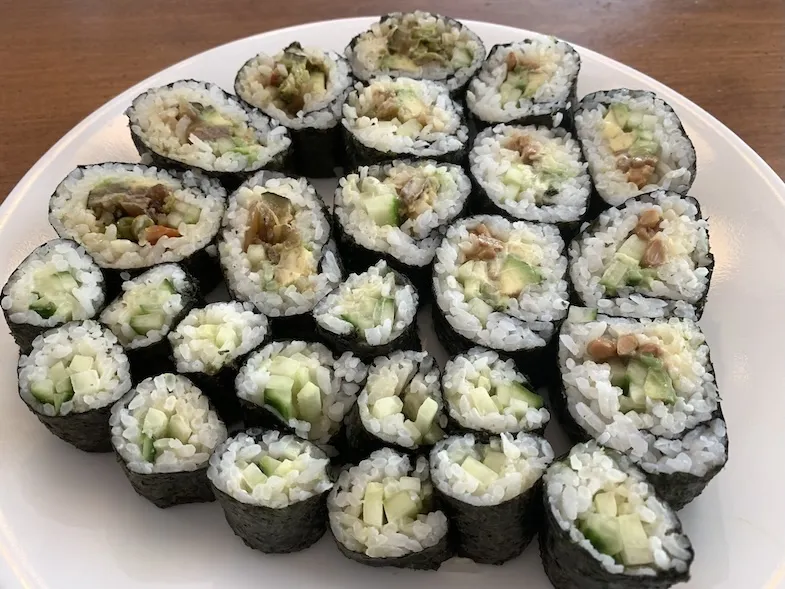 cut maki sushi rolls on a plate