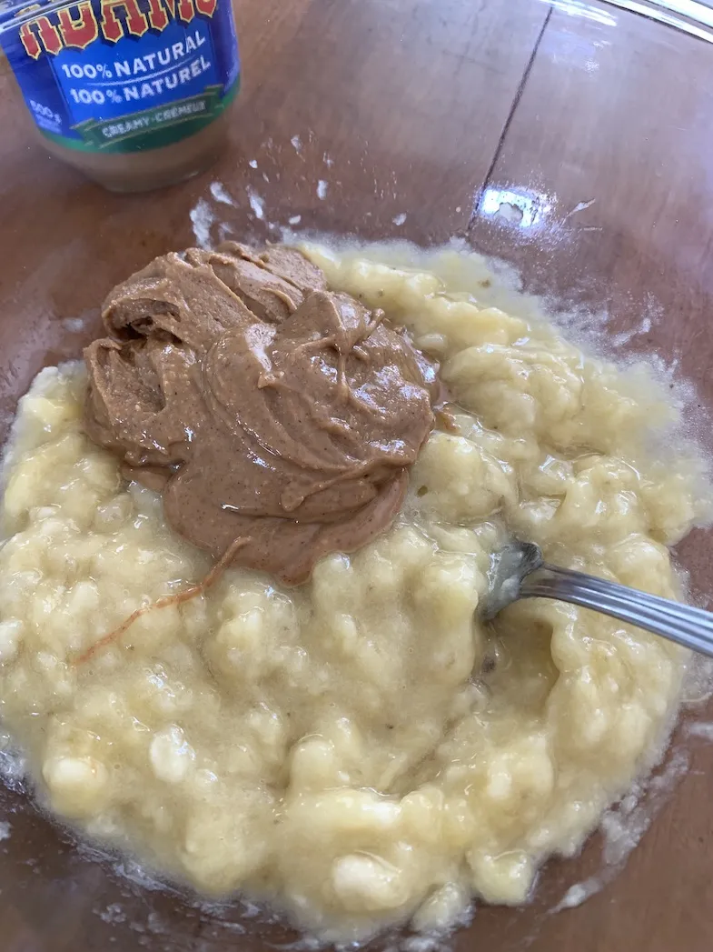 mashed bananas with peanut butter in a bowl