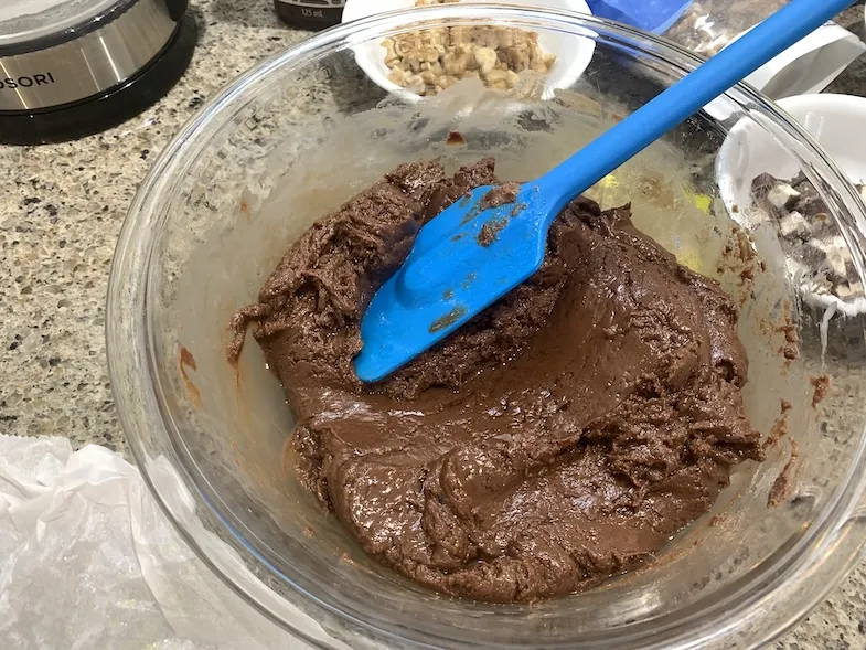 melted milk chocolate chips and condensed milk in a bowl