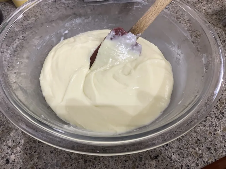 bowl of melted white chocolate chips with condensed milk