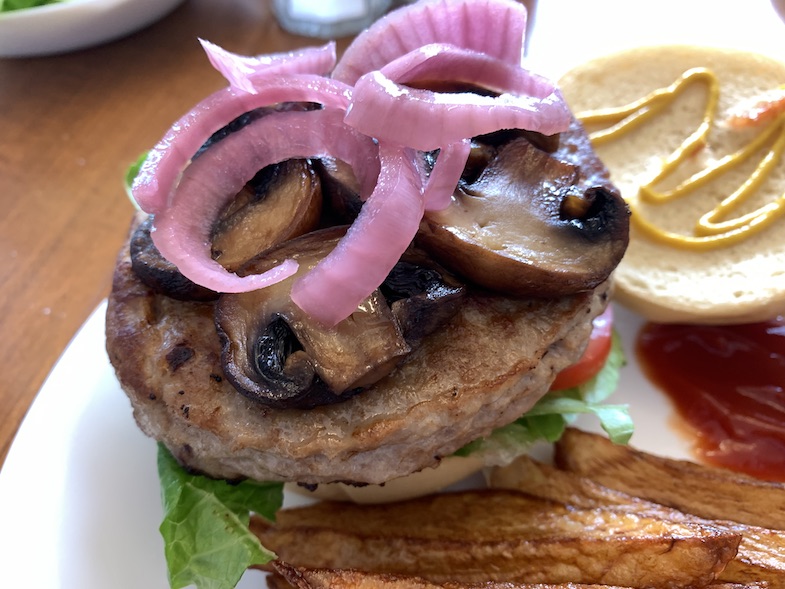 pickled red onions on a burger