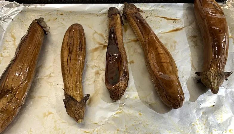 Roasted Japanese eggplant on a baking tray