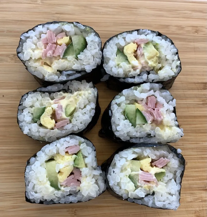 maki sushi roll cut on a wooden board