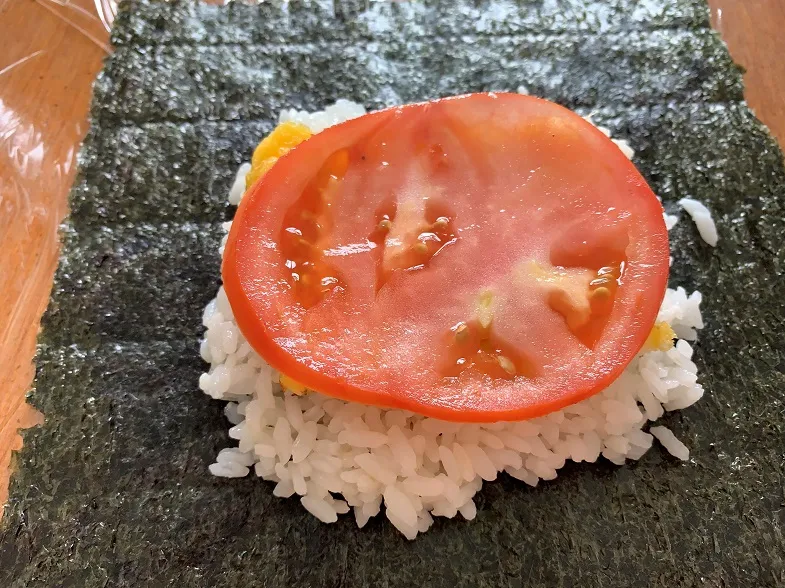 tomato slice on top of the egg