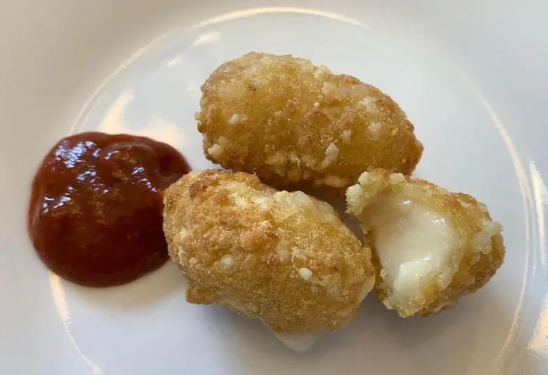 Wholly Veggie gluten-free vegetable mozzarella sticks on a plate